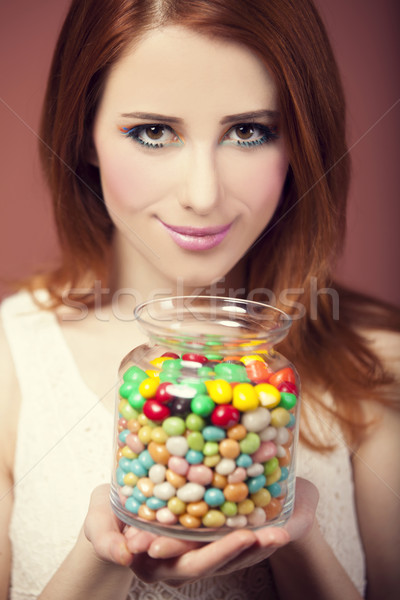 young woman holding a bowl full of jelly beans  Stock photo © Massonforstock