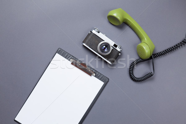 Business board and green handset with retro camera  Stock photo © Massonforstock
