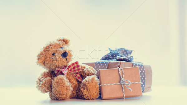cute teddy bear and beautiful gifts on the wonderful white backg Stock photo © Massonforstock