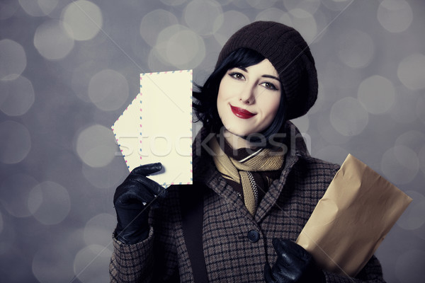 Young postman girl with mail. Photo in old color style with boke Stock photo © Massonforstock