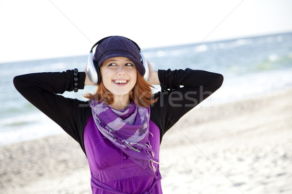 Portré lány fejhallgató tengerpart sapka nő Stock fotó © Massonforstock