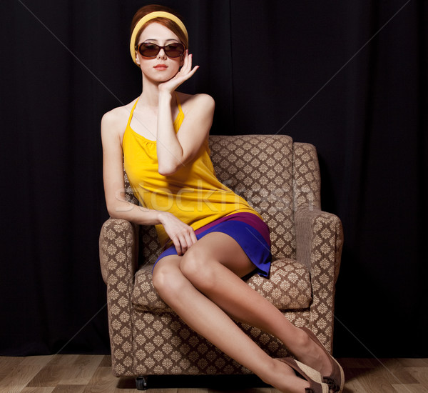 Vörös hajú nő lány fotel 70-es évek kéz divat Stock fotó © Massonforstock