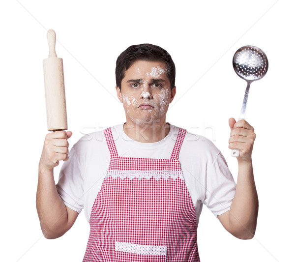 Cooking man with kitchenware  over white bakcground Stock photo © Massonforstock