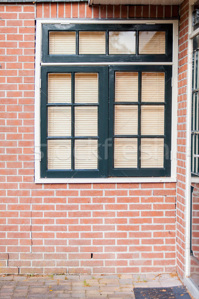 photo of beautiful cool windows with jalousie on one of building Stock photo © Massonforstock