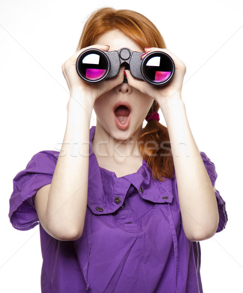 Teen red-haired girl with binoculars isolated on white backgroun Stock photo © Massonforstock