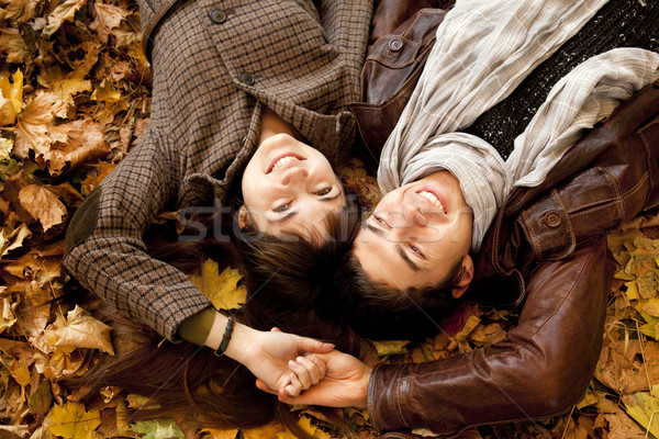 Couple lying in the park in fall Stock photo © Massonforstock