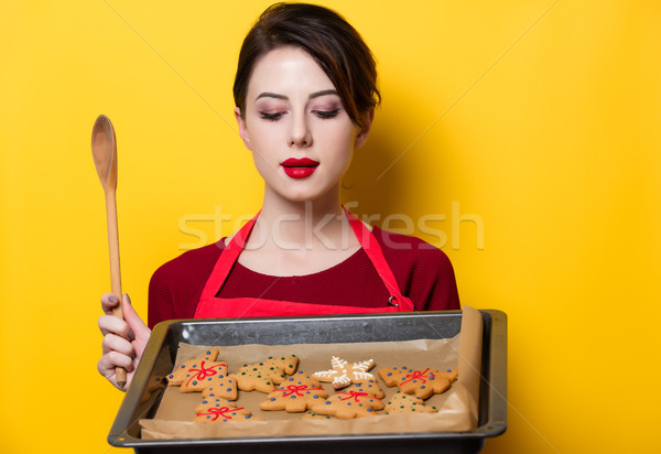 young housewife with gingerbread cookie  Stock photo © Massonforstock