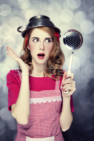 Redhead housewife with soup ladle Stock photo © Massonforstock