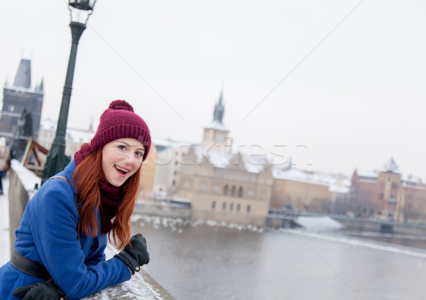 beautiful young woman standing on the bridge near stone fence Stock photo © Massonforstock
