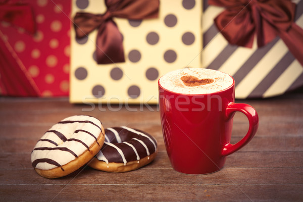 photo of cup of coffee and donuts on the wonderful gifts backgro Stock photo © Massonforstock