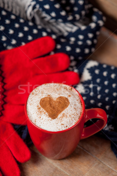 photo of cup of coffee, scarf and gloves on thw wonderful brown  Stock photo © Massonforstock