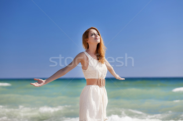 Young redhead girl at the beach. Stock photo © Massonforstock
