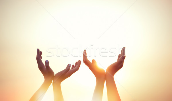 four hands on sunset  Stock photo © Massonforstock