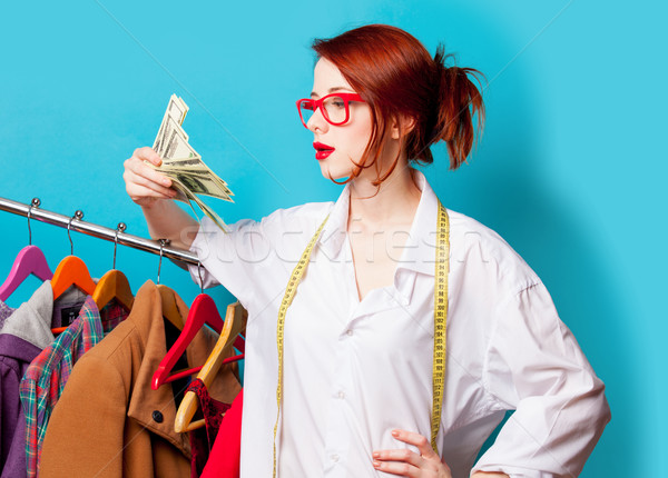 Fotó gyönyörű fiatal nő centiméter pénz ruházat Stock fotó © Massonforstock