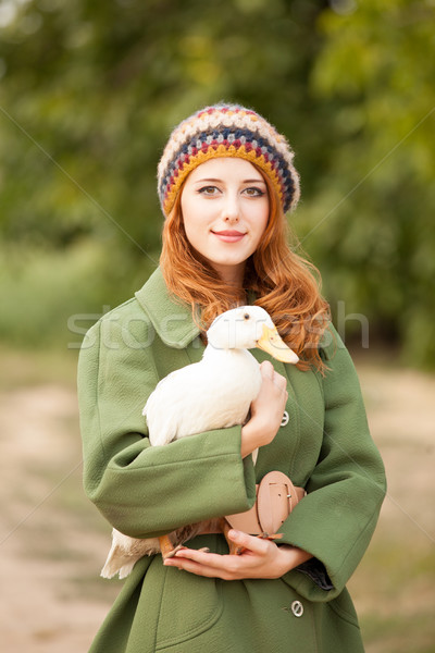 photo of beautiful young woman with goose on the wonderful trees Stock photo © Massonforstock