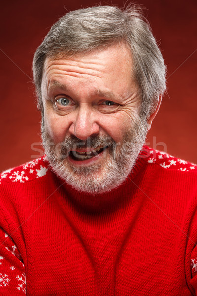 The expressive portrait on red background of a pouter man  Stock photo © master1305