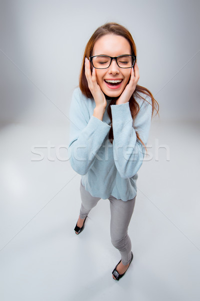 The smiling young business woman on gray background Stock photo © master1305