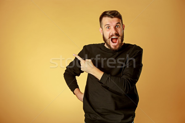 Portrait of young man with shocked facial expression Stock photo © master1305