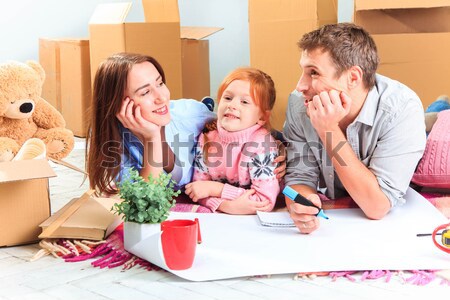 The happy family  during repair and relocation Stock photo © master1305