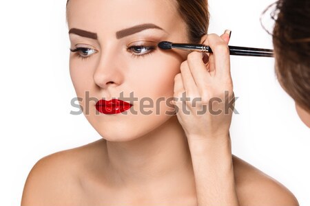 Beautiful female eyes with bright blue make-up and brush Stock photo © master1305