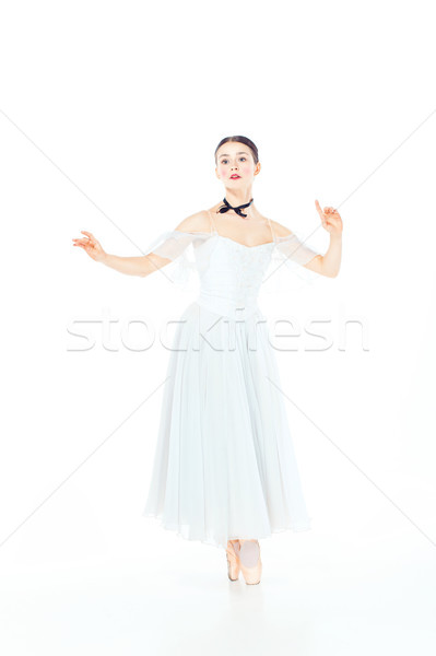 Ballerina in white dress posing on pointe shoes, studio background. Stock photo © master1305