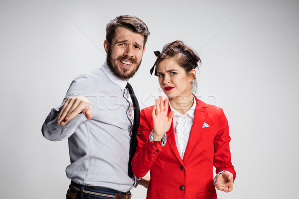 The business man and woman communicating on a gray background Stock photo © master1305