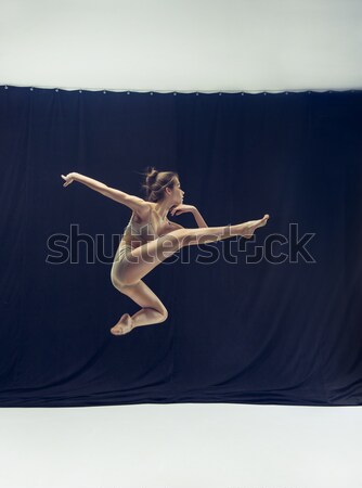 Fiatal gyönyörű táncos bézs ruha tánc Stock fotó © master1305