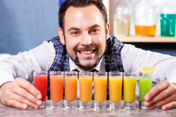 Stock photo: Barman at work, preparing cocktails.