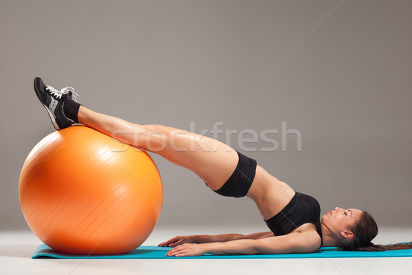 The young, beautiful, sports girl doing exercises on a fitball  Stock photo © master1305