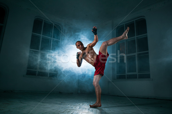Fiatalember kickbox kék füst fiatal férfi Stock fotó © master1305