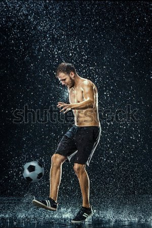 Vízcseppek körül futballista fekete víz férfi Stock fotó © master1305
