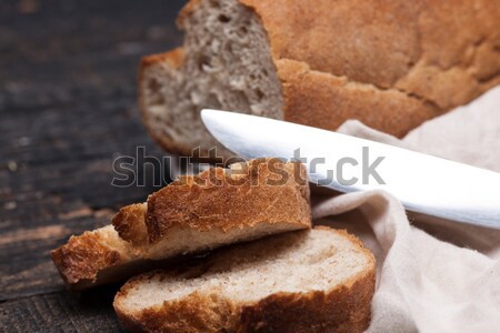 Rustic bread on wood table. Dark woody background with free text space. Stock photo © master1305