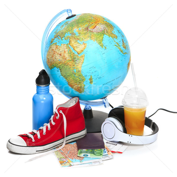 The blue globe, sneakers, thermos and headphones on white background. Stock photo © master1305