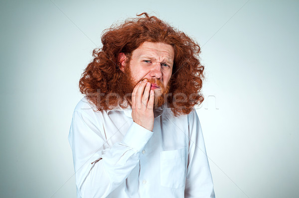 Young man is having toothache. Stock photo © master1305
