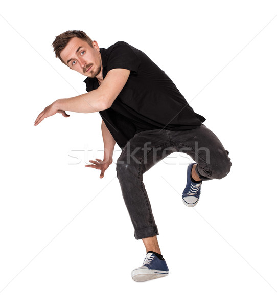 Break dancer doing one handed handstand against a white background Stock photo © master1305