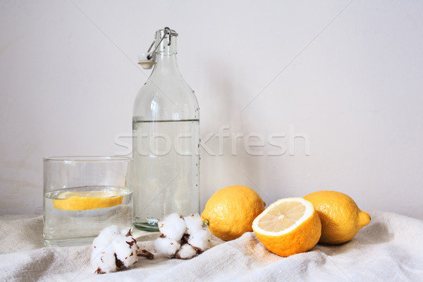 Tasty cool beverage with lemon on white cotton fabric Stock photo © master1305