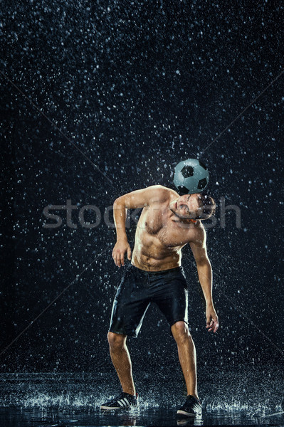 Water drops around football player Stock photo © master1305