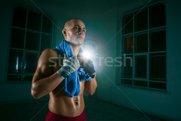The young man kickboxing on black background Stock photo © master1305