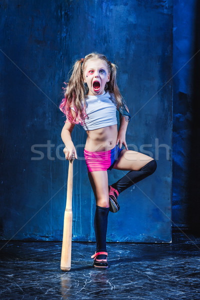 Halloween theme: Girl with baseball bat ready to hit Stock photo © master1305