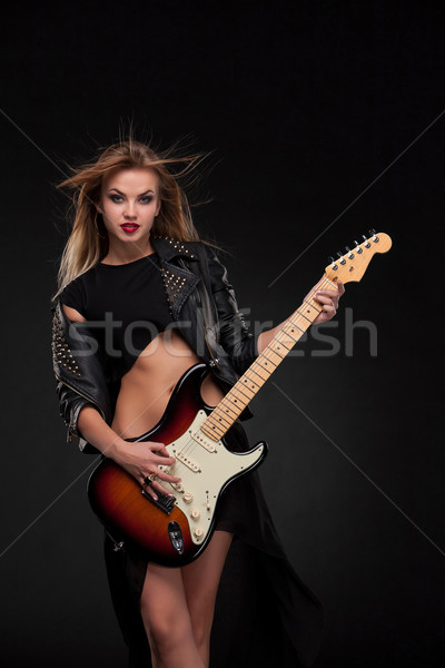 Stock photo: Beautiful girl playing guitar