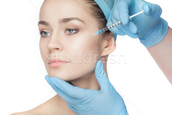 Plastik cerrahi şırınga yüz beyaz el Stok fotoğraf © master1305