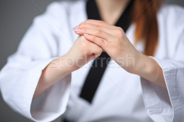 Stock photo: The karate girl with black belt 