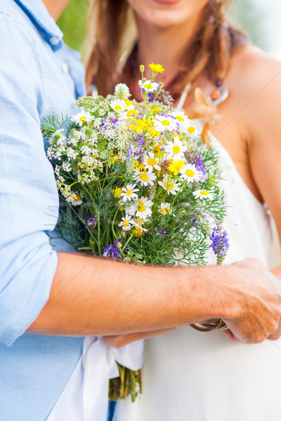 The crop image of romantic couple with flowers Stock photo © master1305