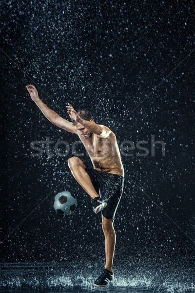 Water drops around football player Stock photo © master1305