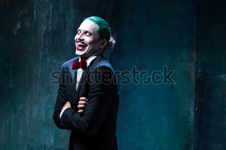 The scary clown holding a knife on dack. Halloween concept Stock photo © master1305