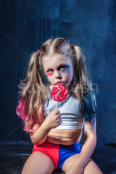 The funny crasy girl with candy on dark background Stock photo © master1305