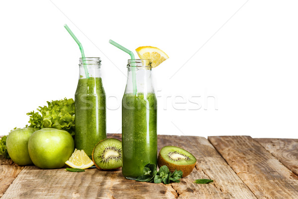 The bottles with fresh vegetable juices on wooden table Stock photo © master1305