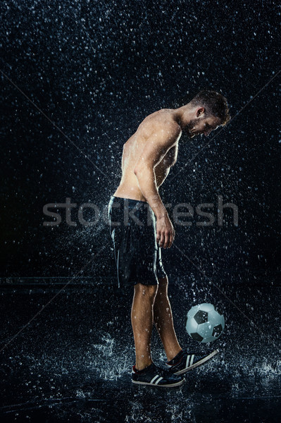 Water drops around football player Stock photo © master1305