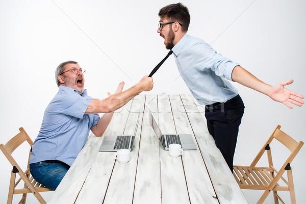 Business conflict. The two men expressing negativity while one man grabbing the necktie of her oppon Stock photo © master1305