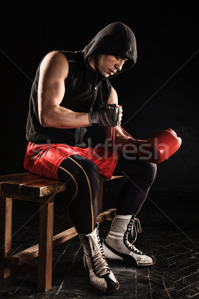 The young  man kickboxing lacing glove Stock photo © master1305